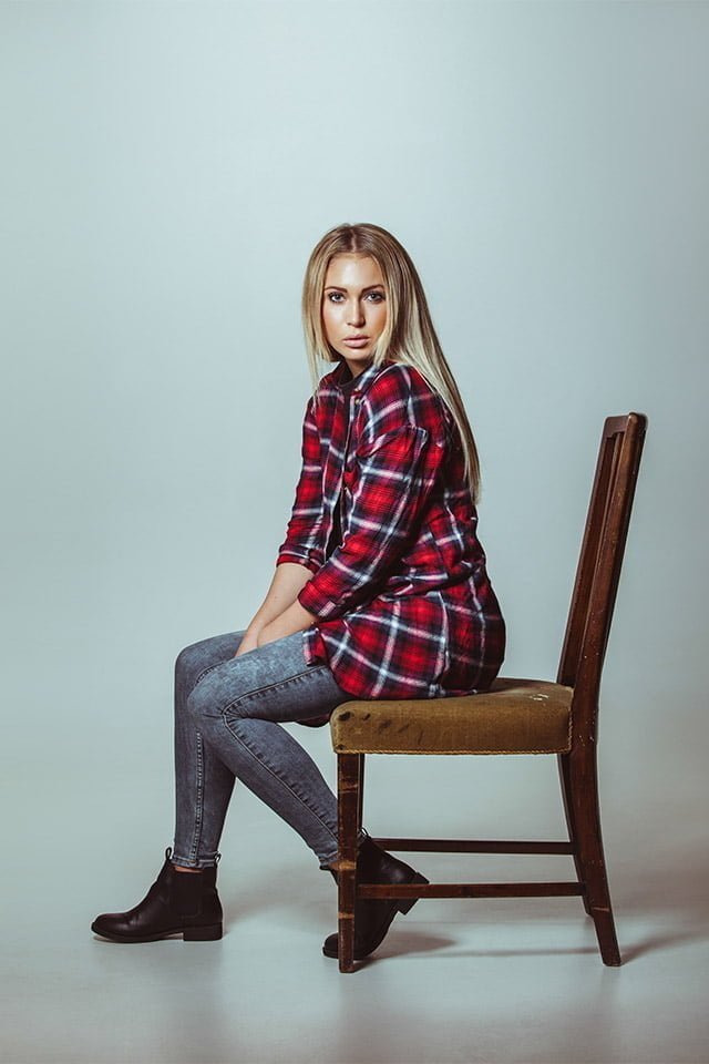 beautiful young woman sitting on chair